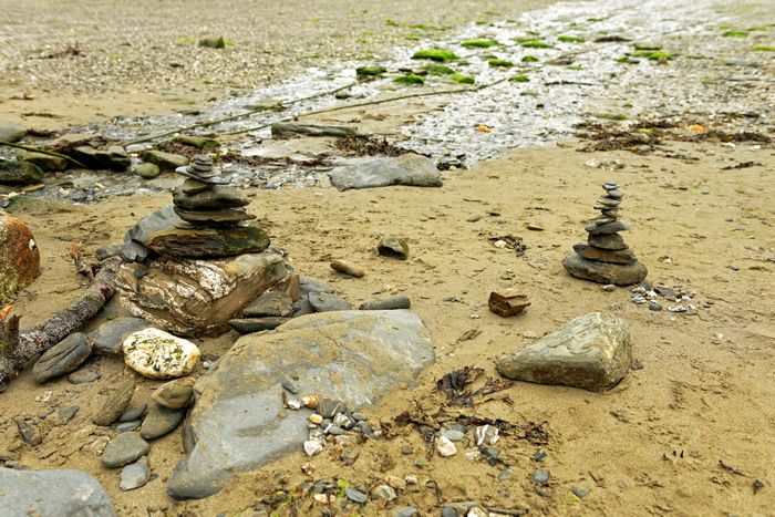 Stacked Stones on Durgan Beach, Cornwall by Rod Johnson